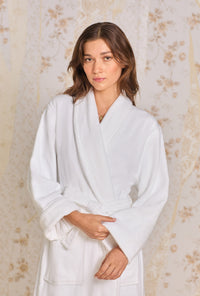 A lady wearing Iconic White Cotton Terry Wrap Robe