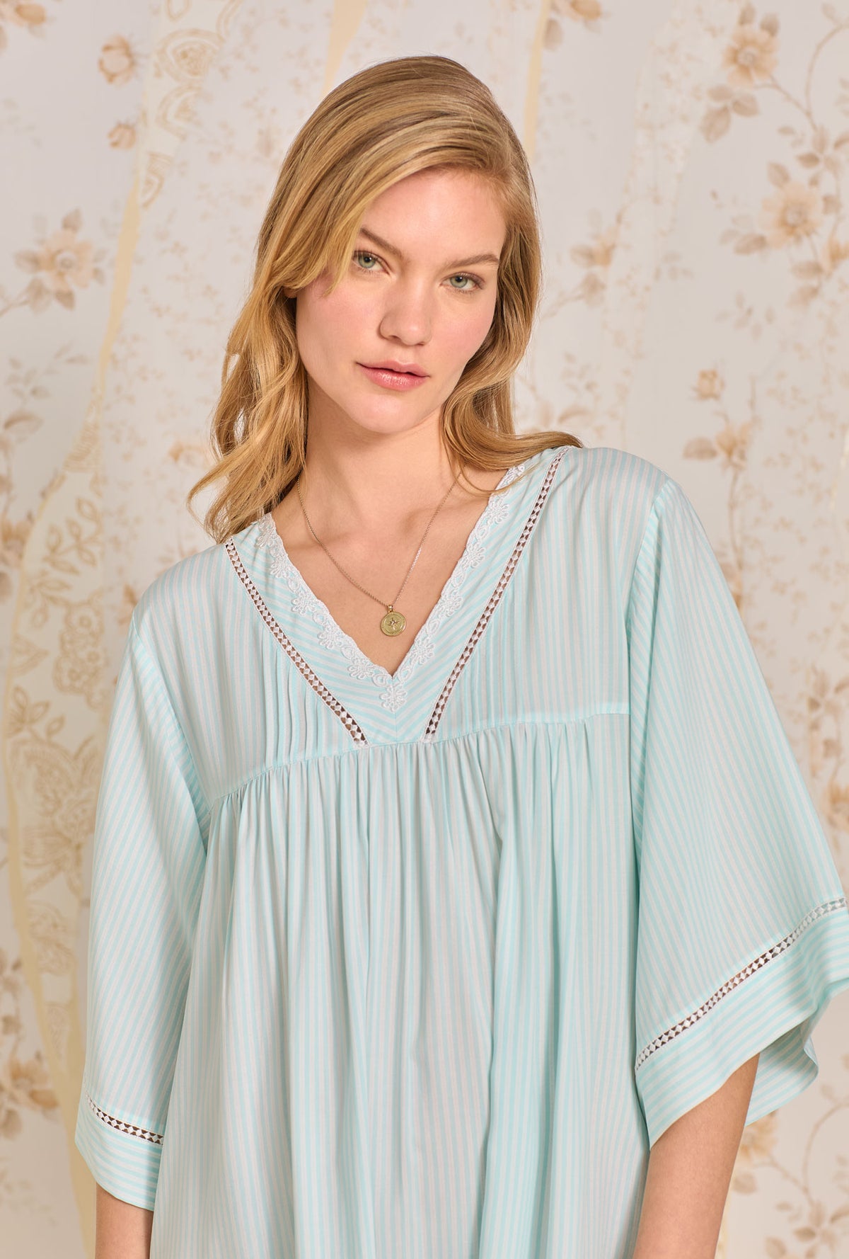 A lady wearing Ecovero  Coastal Stripe Classic Caftan