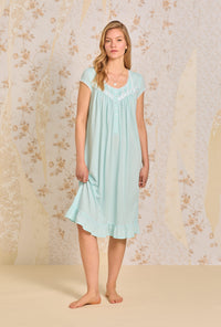 A lady wearing Dream Aqua Solid Waltz Knit Nightgown