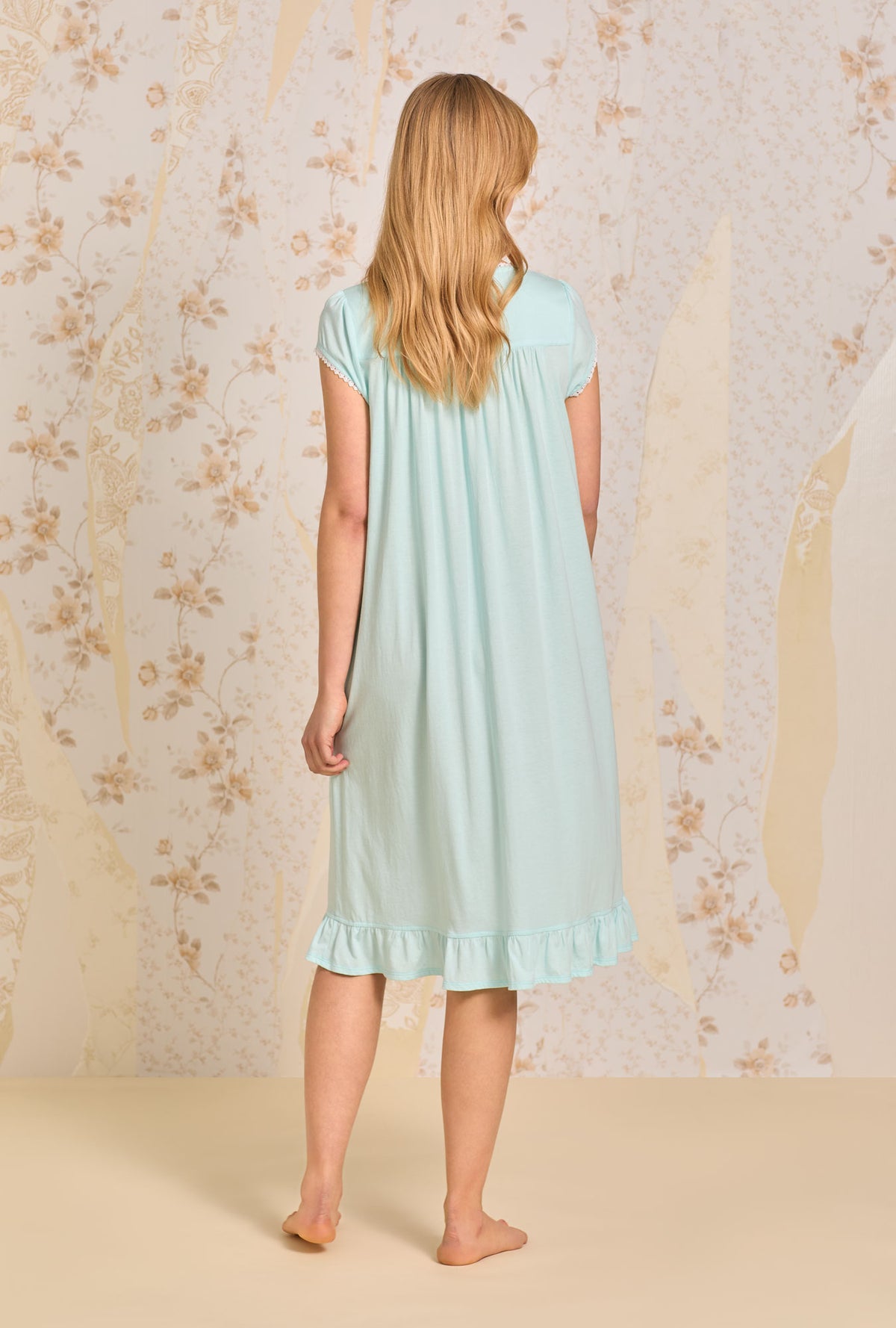 A lady wearing Dream Aqua Solid Waltz Knit Nightgown