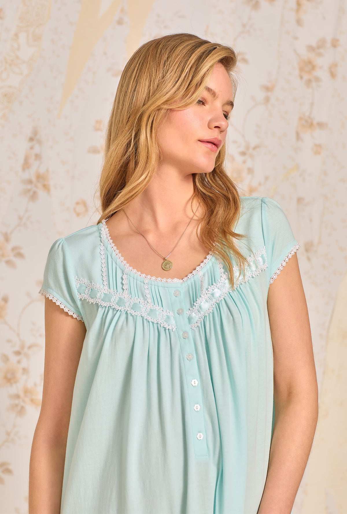 A lady wearing Dream Aqua Solid Waltz Knit Nightgown