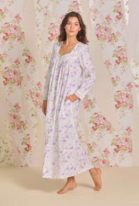 A lady wearing Royal Daisy Cotton Lawn Button Front Robe