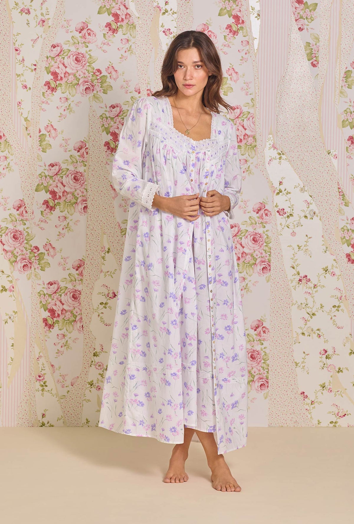 A lady wearing Royal Daisy Cotton Lawn Button Front Robe