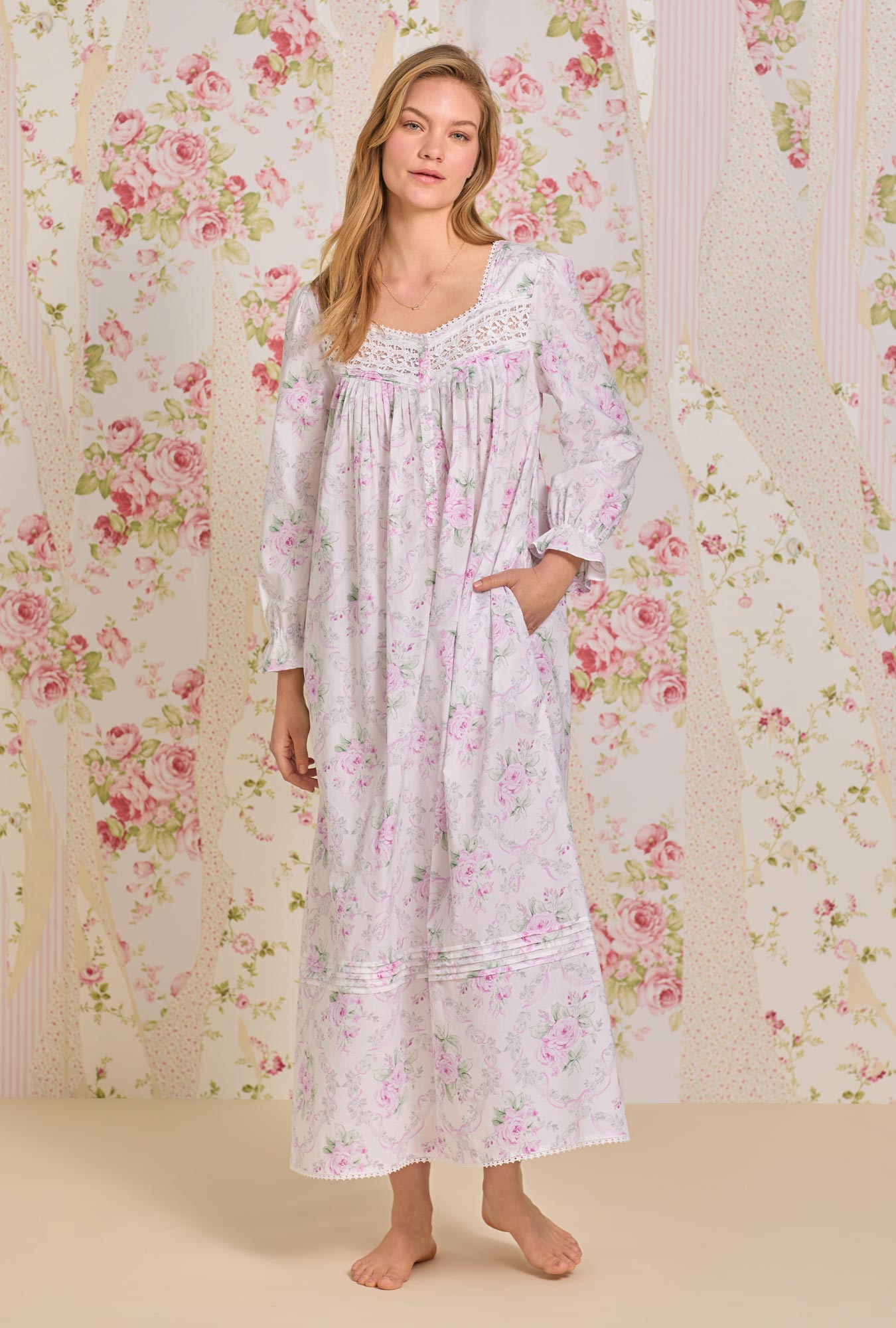 A lady wearing pink long sleeve cotton nightgown with victorian roses.