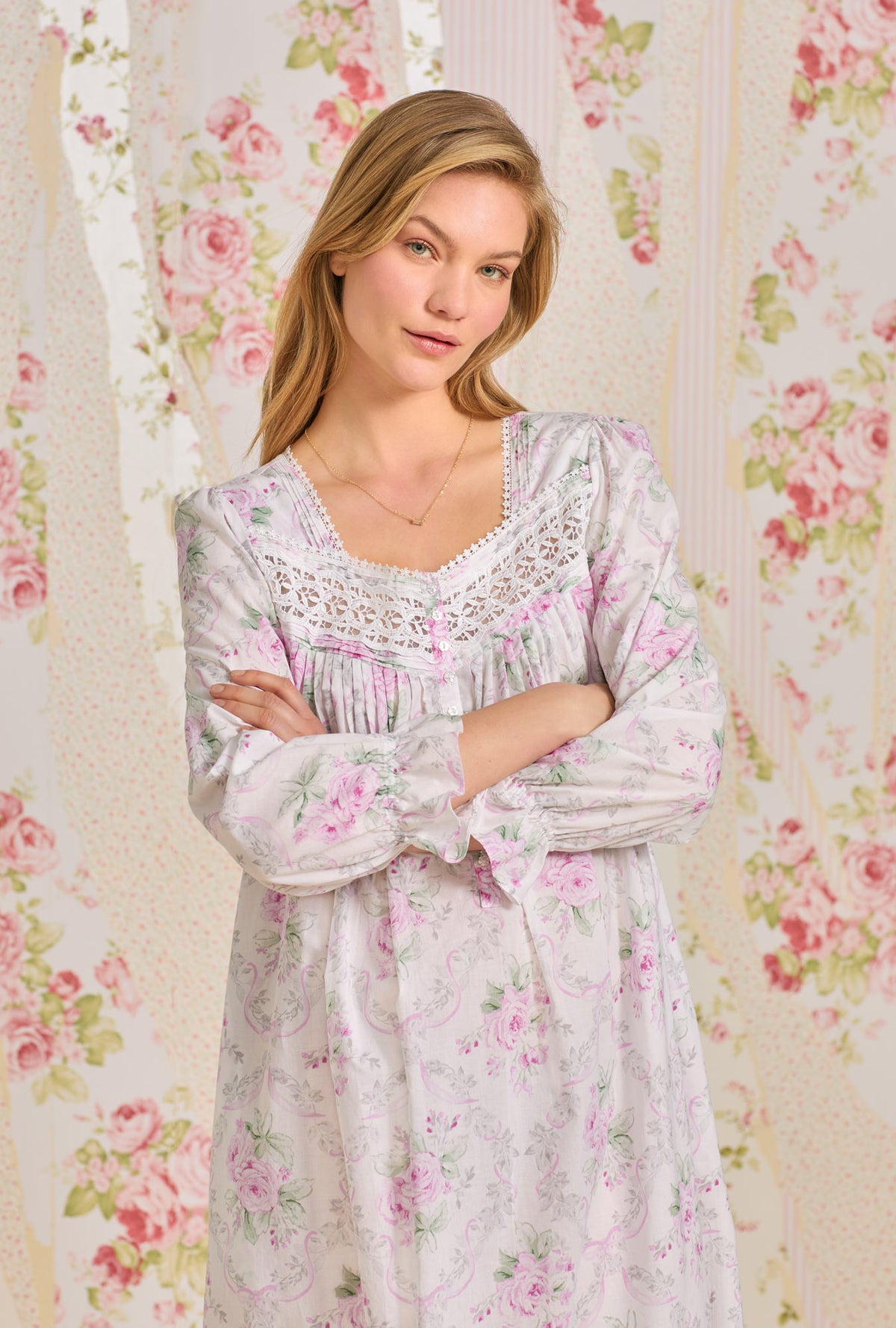 A lady wearing pink long sleeve cotton nightgown with victorian roses.