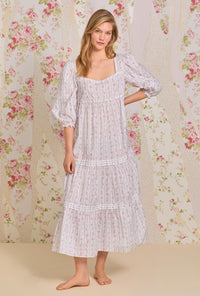 A lady wearing quarter sleeve nightdress with vintage floral stripe print.