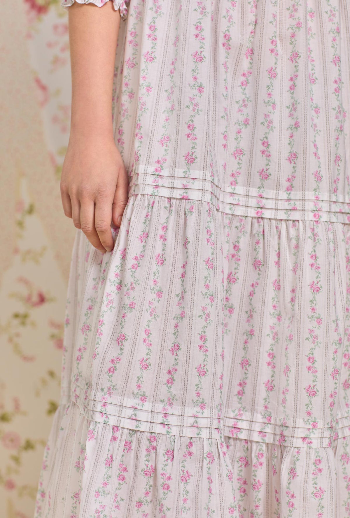 A lady wearing quarter sleeve nightdress with vintage floral stripe print.