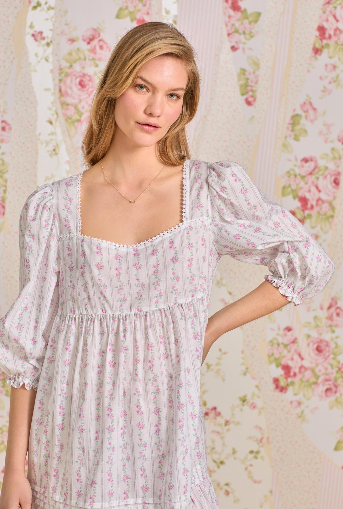 A lady wearing quarter sleeve nightdress with vintage floral stripe print.