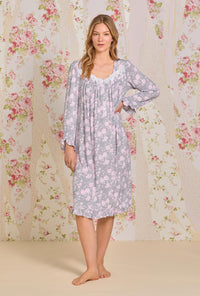 A lady wearing long sleeve waltz knit nightgown with water roses print