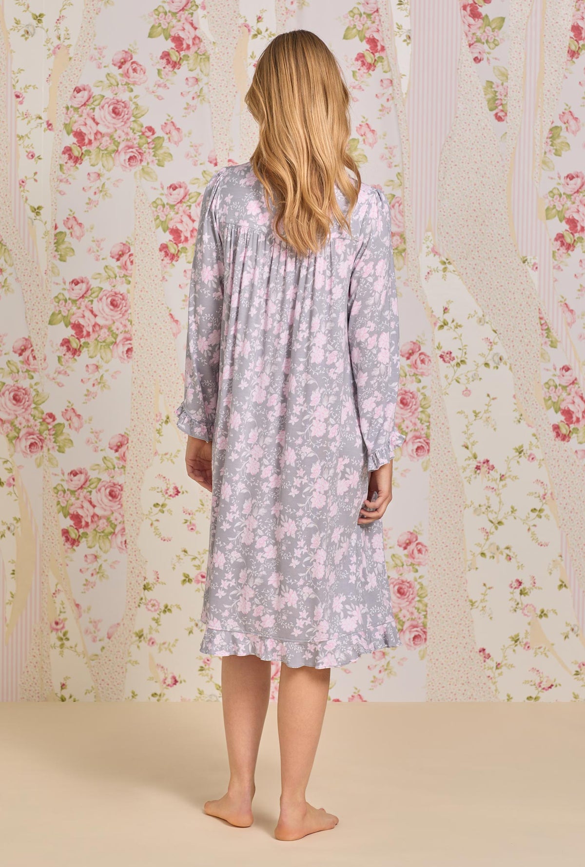 A lady wearing long sleeve waltz knit nightgown with water roses print