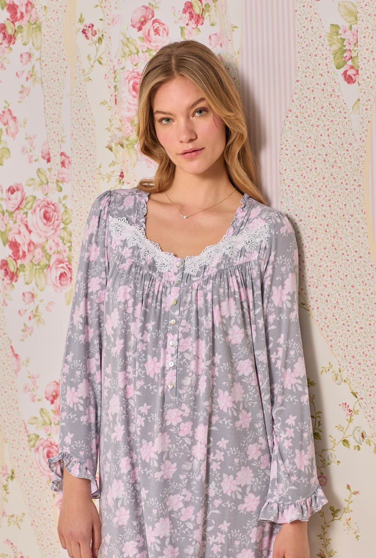 A lady wearing long sleeve waltz knit nightgown with water roses print