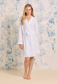 A lady wearing EcoVero Pale Stripe Short Wrap Robe